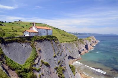 Panoramic view of sea and buildings against sky