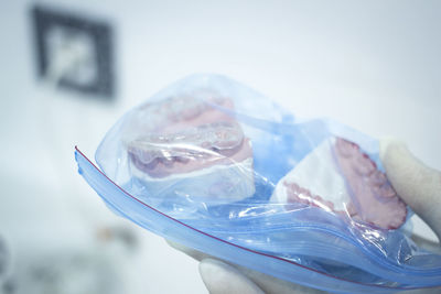 Close-up of dentist holding dental equipment in medical clinic