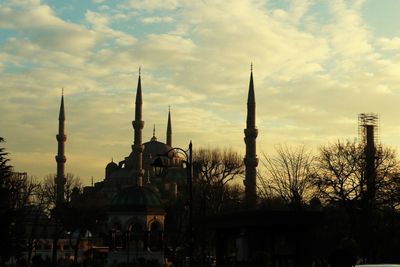 Built structure against sky at sunset