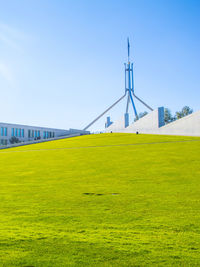 View of bridge on field against clear sky