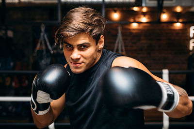 Portrait of man boxing in ring