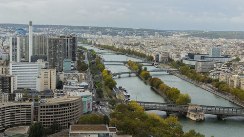 High angle view of bridge over river amidst buildings in city