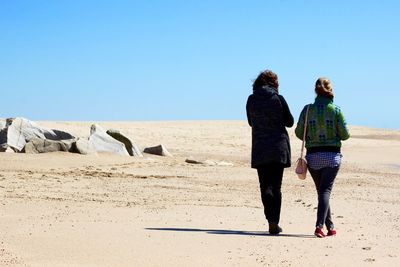 Full length of woman standing against clear sky