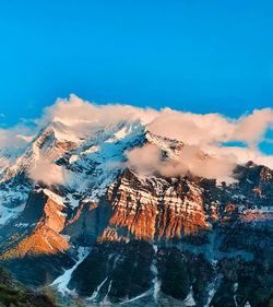 Aerial view of snowcapped mountains against sky