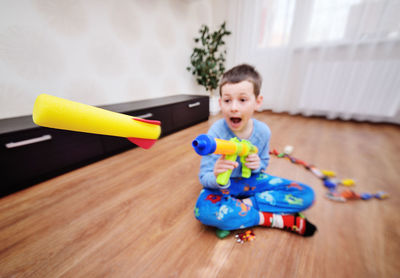 Boy playing with toy on table