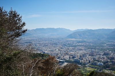 Aerial view of cityscape against sky