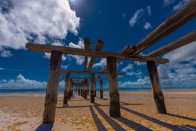 Scenic view of beach against blue sky