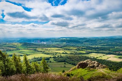 Scenic view of landscape against cloudy sky