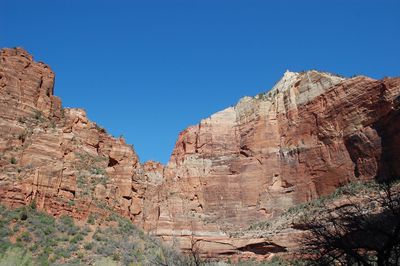 Rock formations against clear blue sky