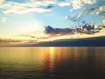 Scenic view of sea against sky at sunset