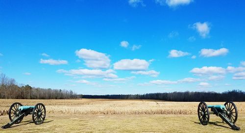 View of agricultural field against blue sky