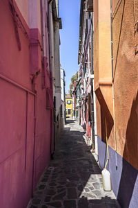 Narrow alley amidst buildings in burano