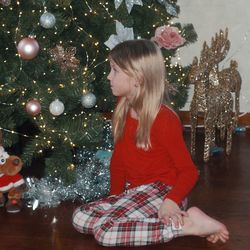 Midsection of woman with christmas tree