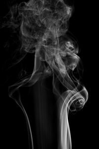 Close-up of smoke against black background