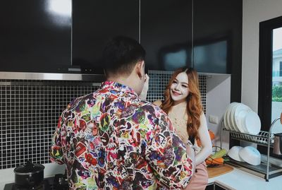 Young couple sitting at home