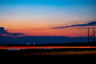 Scenic view of silhouette landscape against romantic sky at sunset