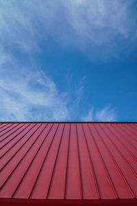 Red roof against sky