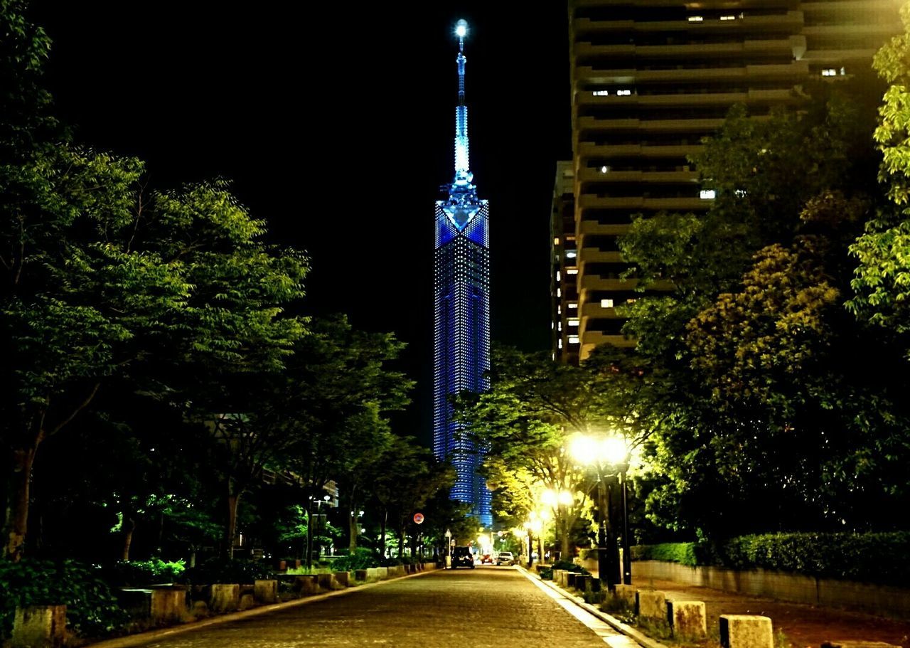 illuminated, the way forward, night, architecture, built structure, building exterior, street light, tree, diminishing perspective, street, transportation, road, city, lighting equipment, vanishing point, sky, outdoors, no people, empty, empty road