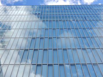 Low angle view of modern building against sky in city