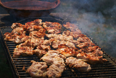 Close-up of meat on barbecue grill