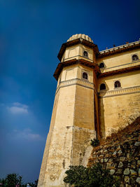 Low angle view of building against blue sky