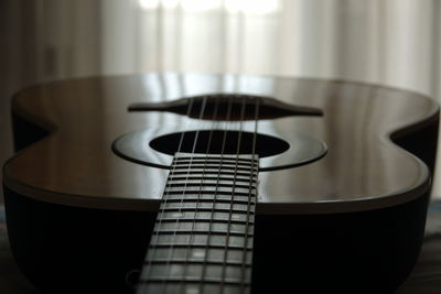 Close-up of guitar at home