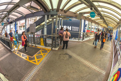 People waiting at railroad station platform