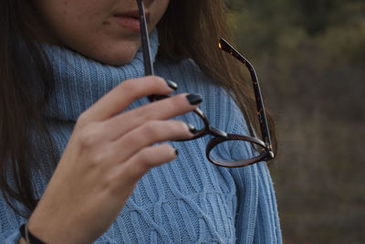 Close-up of woman using mobile phone