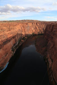 High angle view of river amidst rocky cliffs