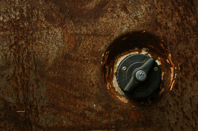 Close-up of knob on rusty metal