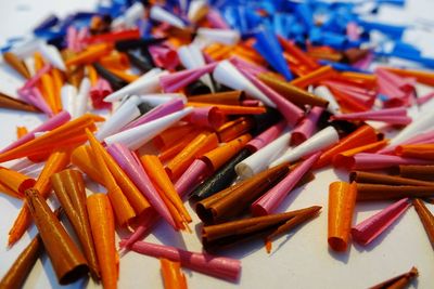 Close-up of crayon shavings on white table