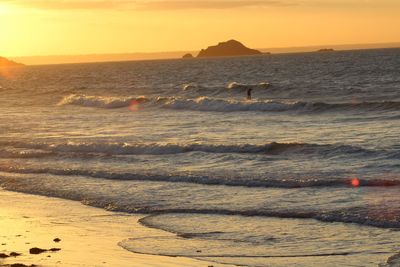 Scenic view of sea against sky during sunset