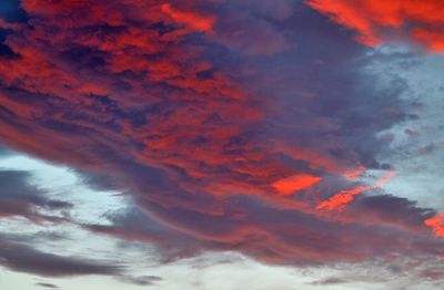 Low angle view of orange cloudy sky