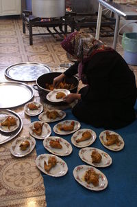 High angle view of man preparing food on table