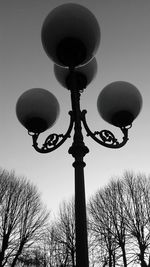 Low angle view of street light against sky