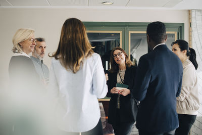 Multi-ethnic entrepreneurs discussing at conference