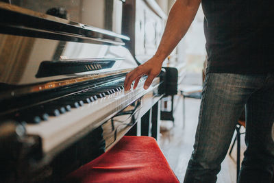 Low angle view of man playing piano