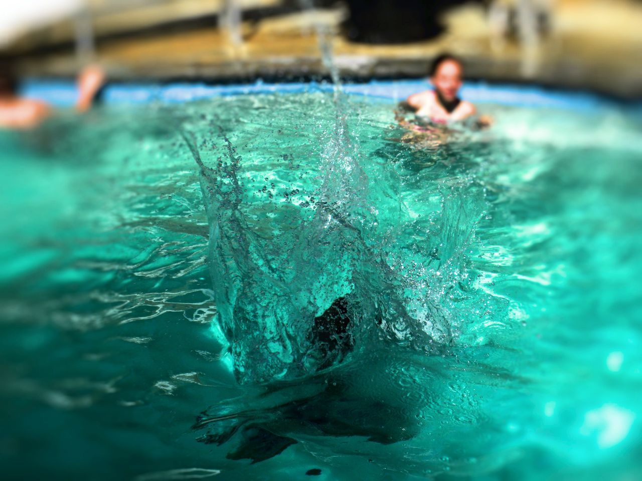 MAN SWIMMING IN POOL