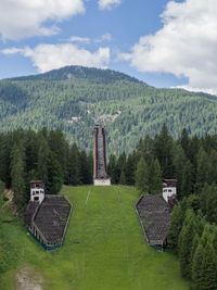 Scenic view of green mountains against sky