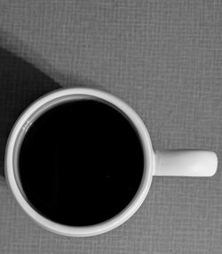 High angle view of coffee cup on table