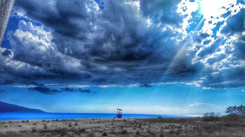 Scenic view of beach against blue sky