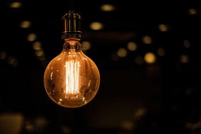 Close-up of illuminated light bulb