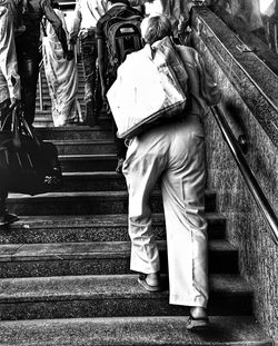 Low section of people standing on railroad station