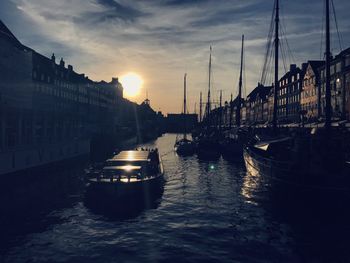 Boats moored at harbor