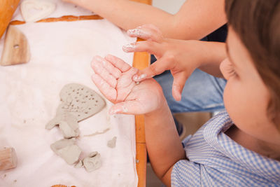 High angle view of girl playing at home