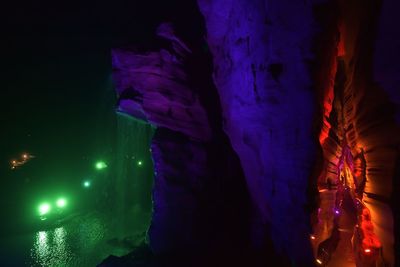 Low angle view of rock formation at night