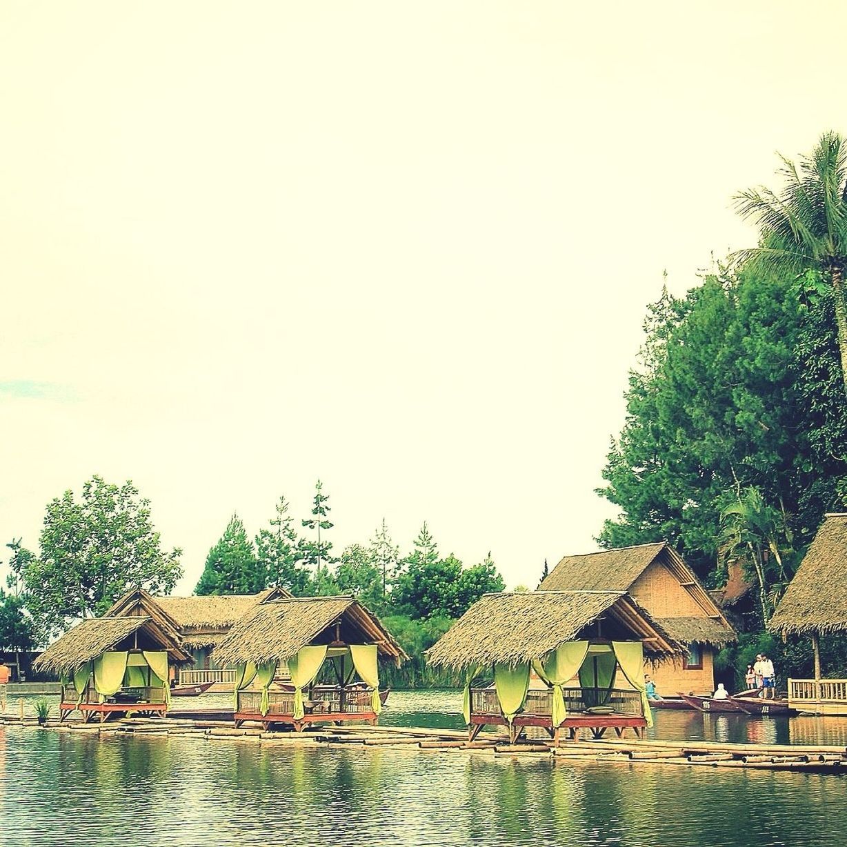 water, clear sky, tree, built structure, architecture, waterfront, building exterior, copy space, house, lake, nautical vessel, river, tranquil scene, tranquility, nature, day, scenics, beauty in nature, outdoors, boat