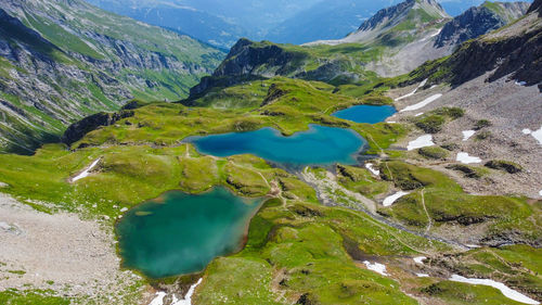 High angle view of lake amidst mountains