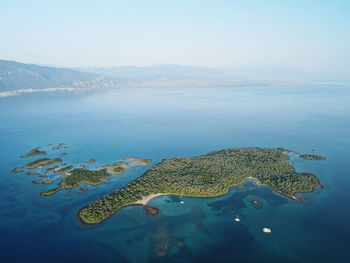 Aerial view of island in sea against sky