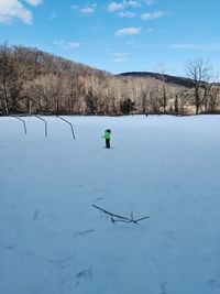 Scenic view of lake against sky during winter